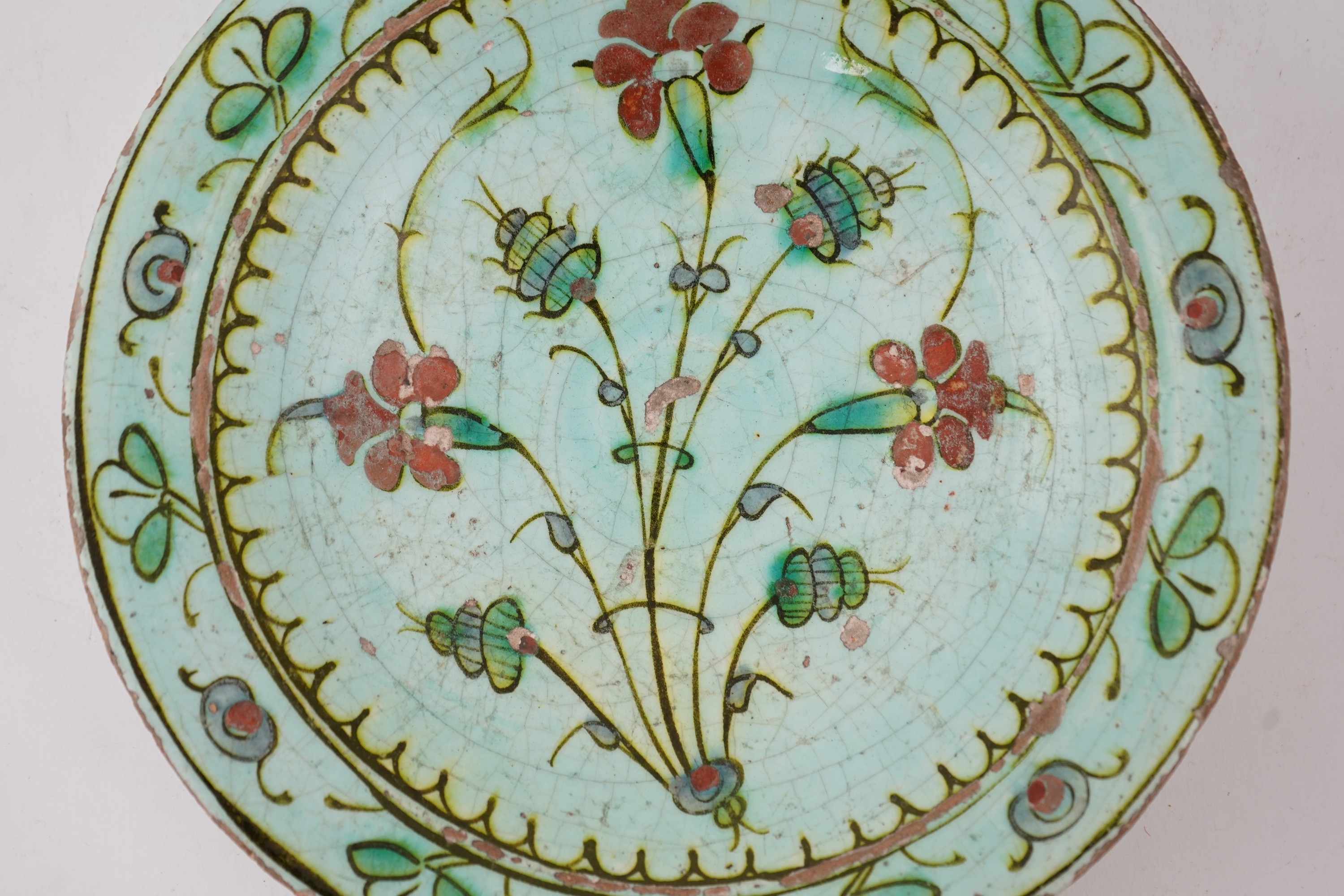 An Iznik pottery turquoise glazed dish, Ottoman Turkey, c.1650-1700